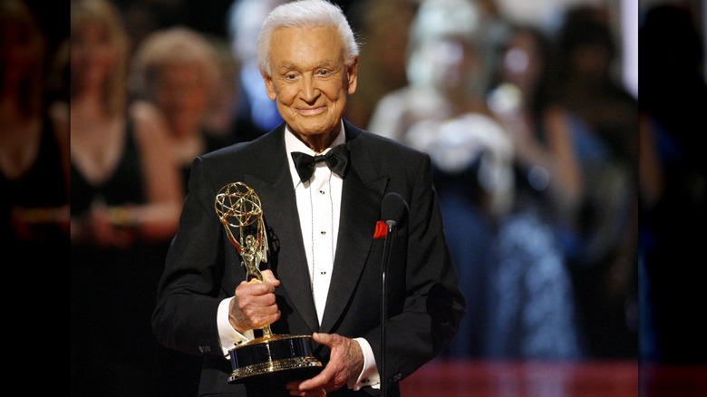 Bob Barker holding Emmy award