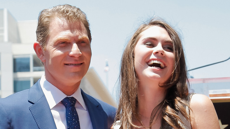 Bobby and Sophie Flay laughing together at an event