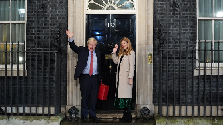 Boris and Carrie Johnson waving outside Number 10 Downing Street