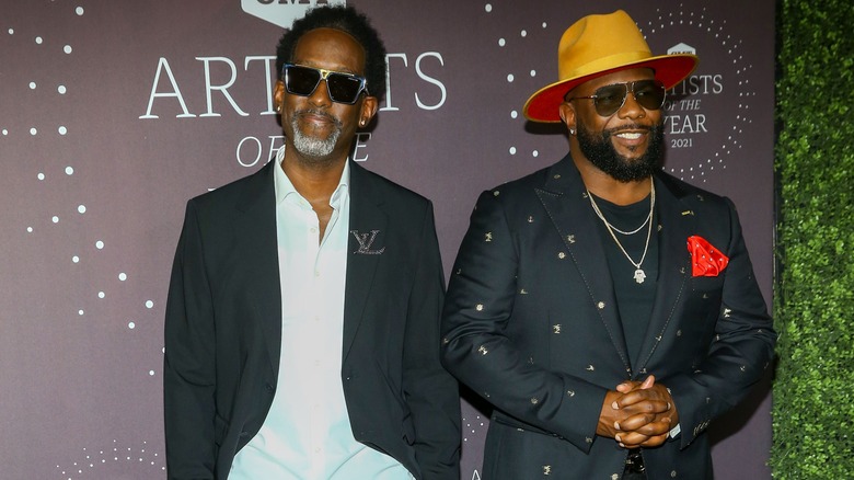 Shawn Stockman and Wanya Morris smiling