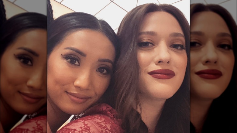 Brenda Song and Kat Dennings smiling