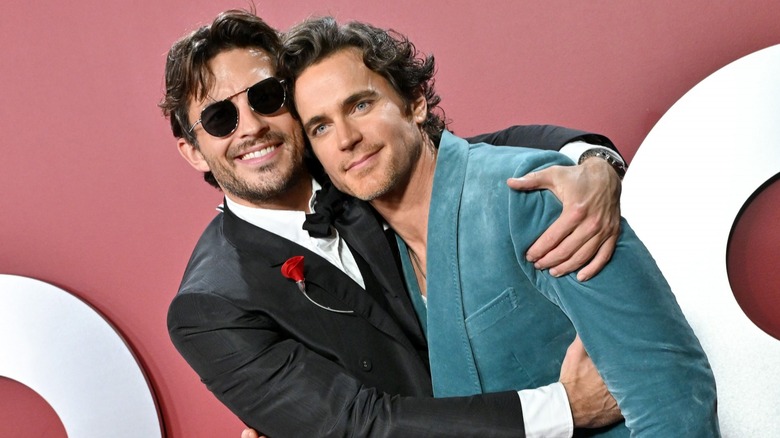 Jonathan Bailey hugging Matt Bomer