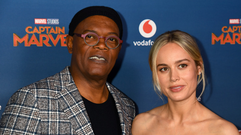 Brie Larson and Samuel L. Jackson posing for photos