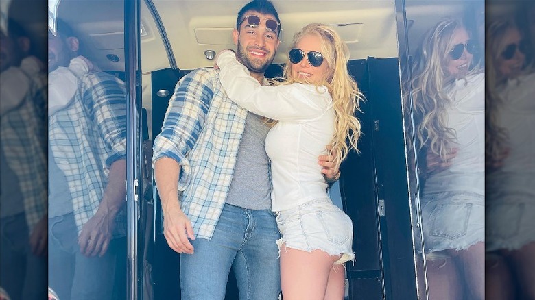 Britney Spears and Sam Asghari, posing and smiling