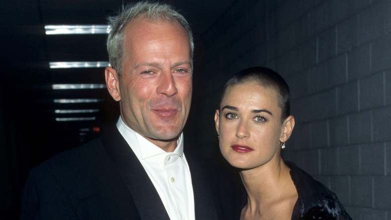 Bruce Willis and Demi Moore posing