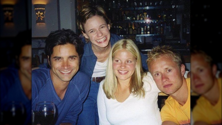 John Stamos, Andrea Barber, Valeri Bure, and Candace Cameron Bure smiling