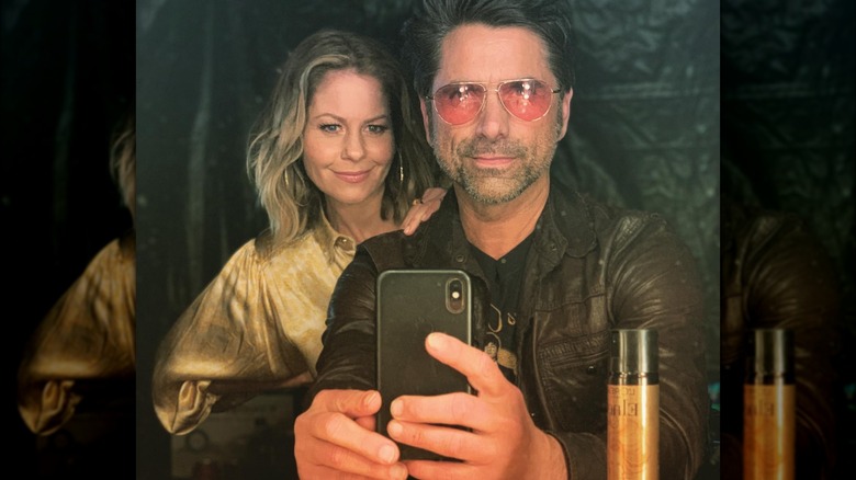 Candace Cameron Bure and John Stamos taking mirror selfie