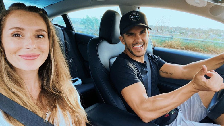 Alexa and Carlos PenaVega taking a car selfie