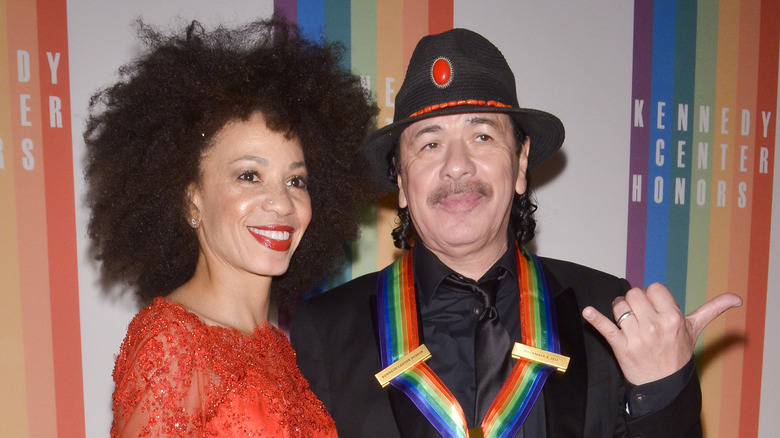 Carlos Santana and wife Cindy Blackman pose on the red carpet together