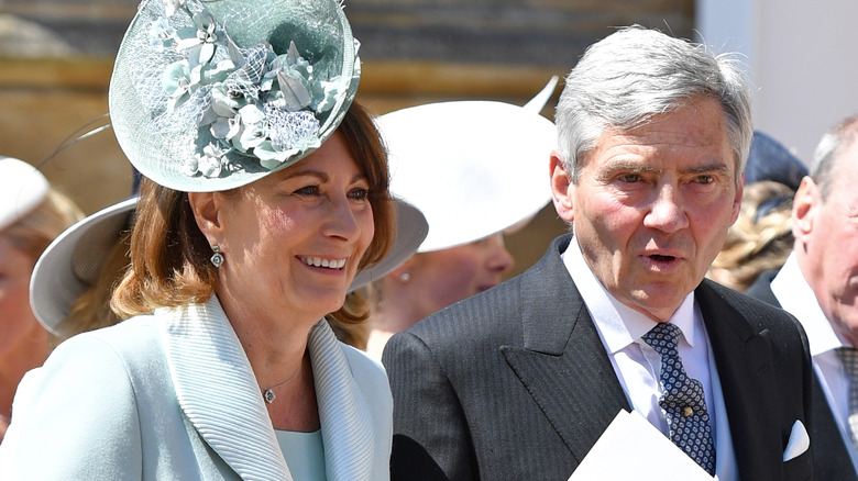 Carole Middleton and Michael Middleton talking