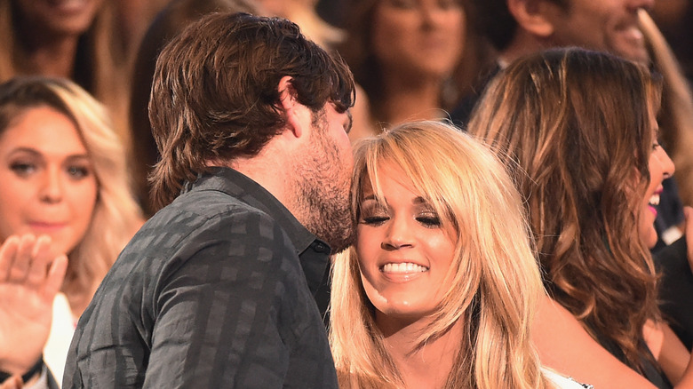Mike Fisher kissing Carrie Underwood