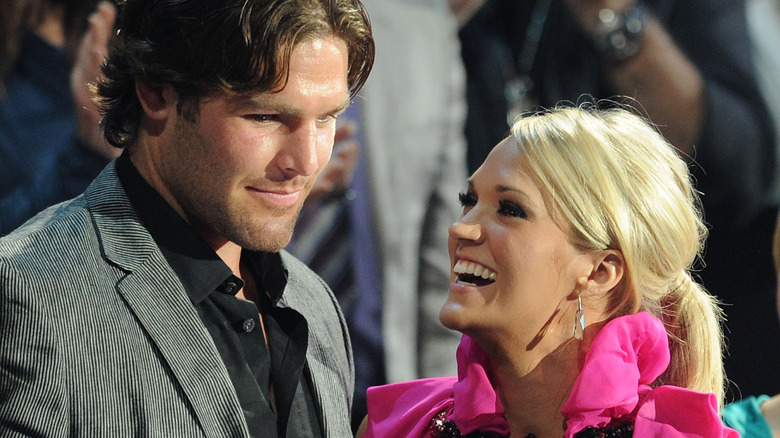 Carrie Underwood grinning at Mike Fisher
