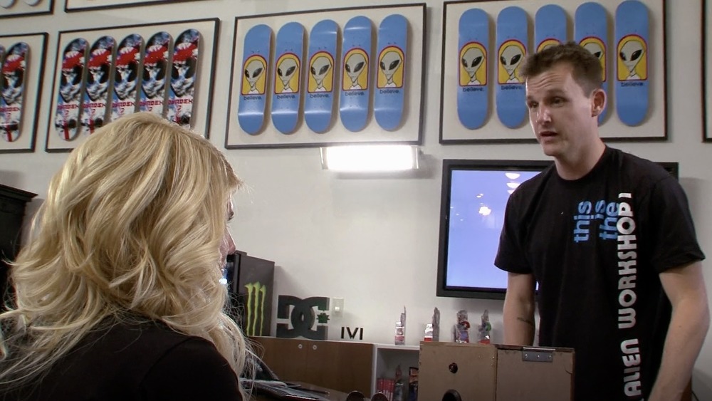 Chanel West Coast and Rob Dyrdek at a desk