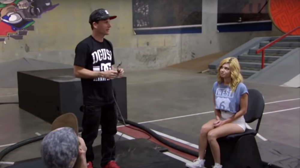 Chanel West Coast looking up at Rob Dyrdek