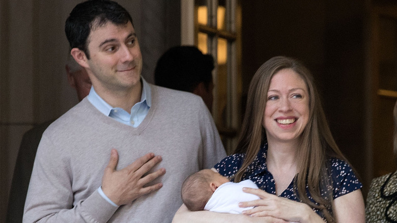 Chelsea Clinton and Marc Mezvinsky with their baby