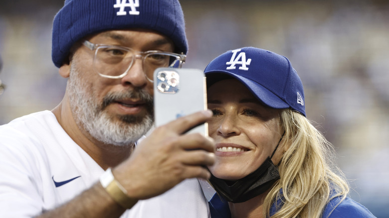 Jo Koy taking a picture with Chelsea andler