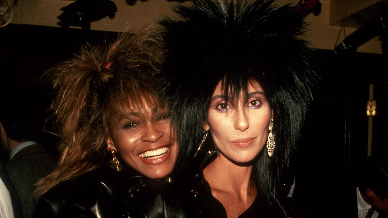 Tina Turner hugging Cher smiling