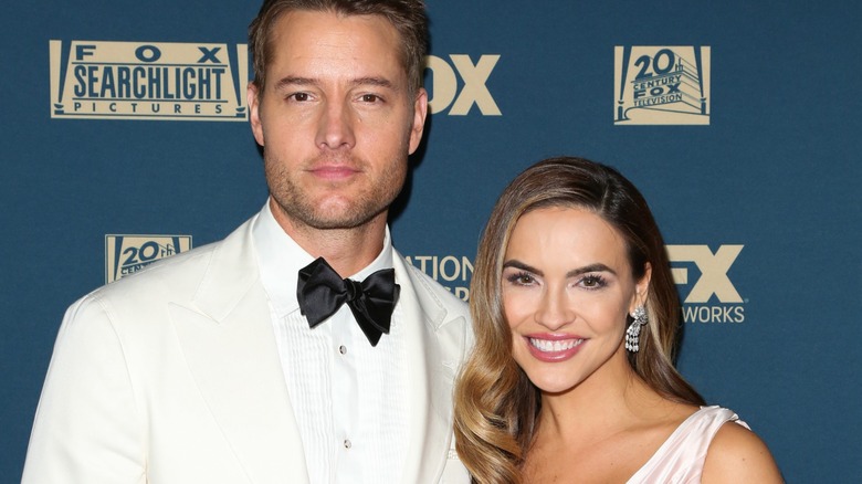 Justin Hartley and Chrishell Stause wearing white