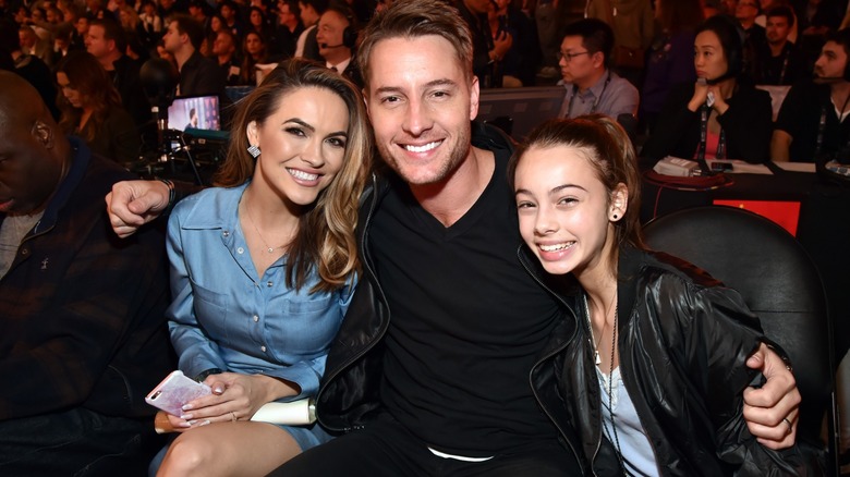 Justin Hartley, Chrishell Stause, Bella Hartley posing