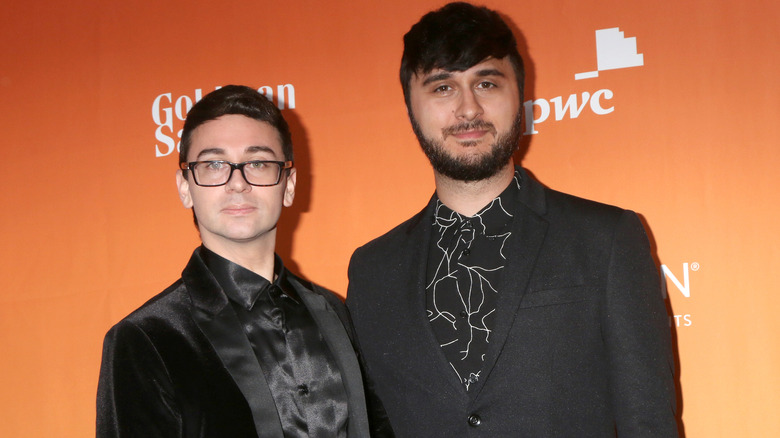 Christian Siriano and Brad Walsh dressed in all black at an event