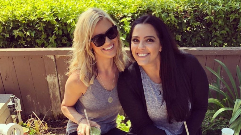 Christina Haack and Cassie Zebisch sitting outside