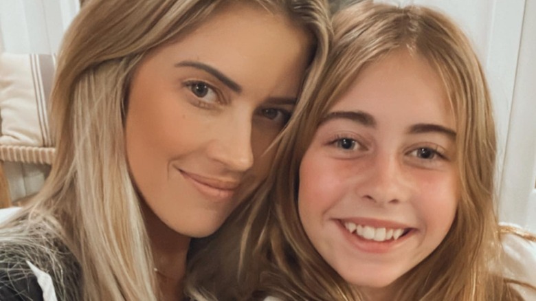 Taylor Hall smiles in close up selfie with her daughter leaning heads