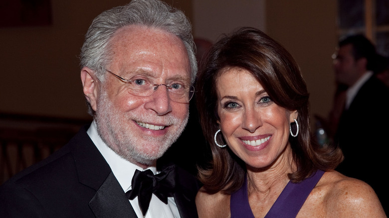 Wolf Blitzer and his wife Lynn smiling at event