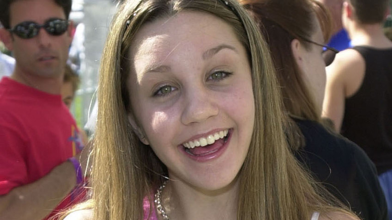 Young Amanda Bynes smiling at camera
