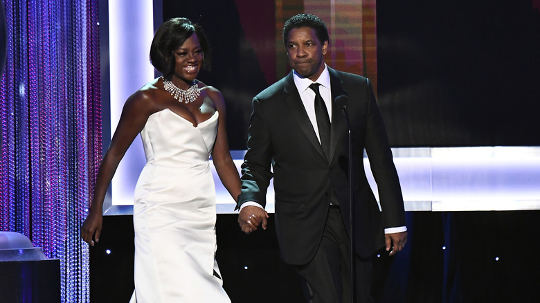 Denzel Washington and Viola Davis holding hands