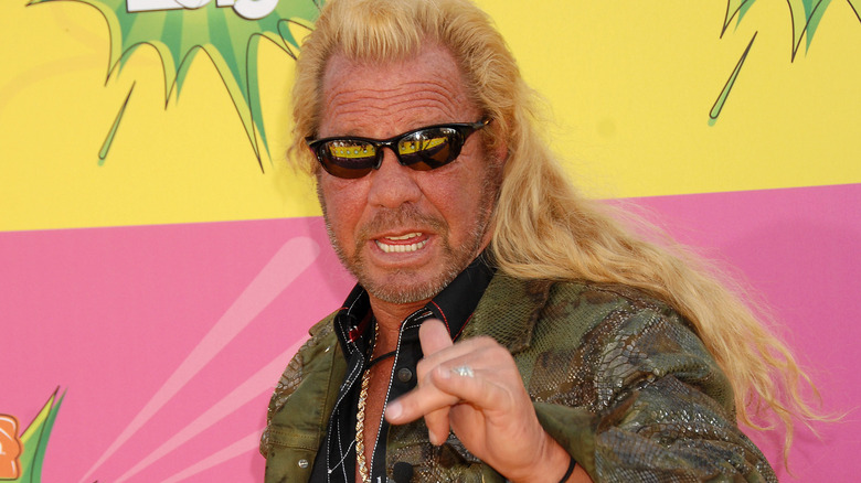 Dog the Bounty Hunter poses at an event