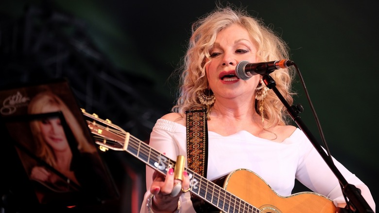 Stella Parton singing onstage