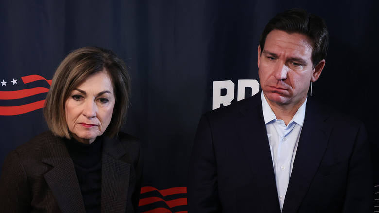 Kim Reynolds and Ron DeSantis standing together