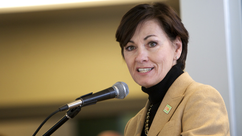 Kim Reynolds in front of microphone