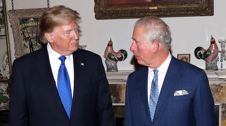 Donald Trump and King Charles looking at each other