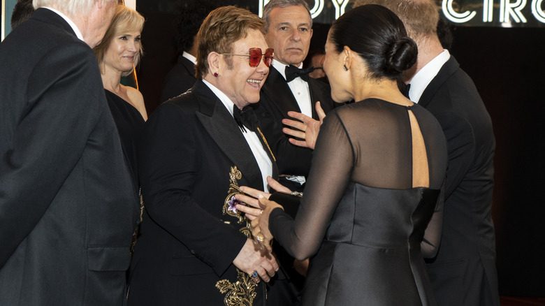 Elton John and Meghan Markle speaking