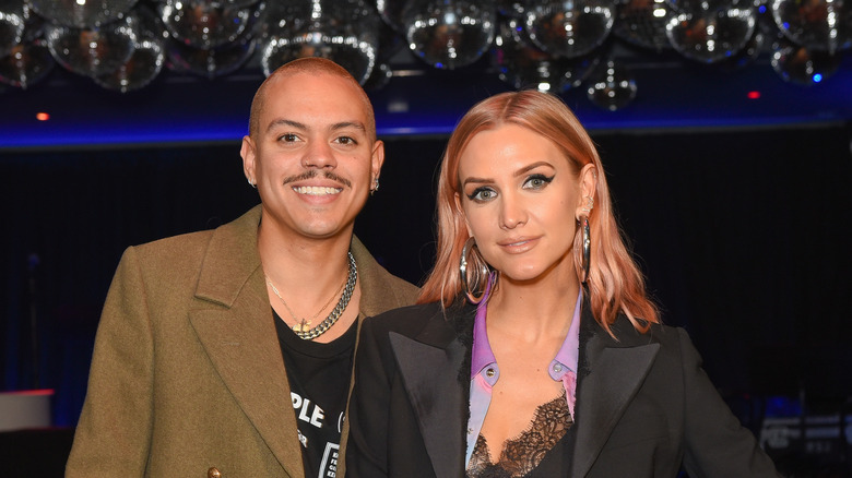 Ashlee Simpson and husband Evan Ross smile for the camera.