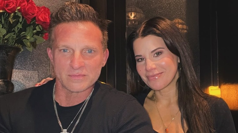 Steve Burton and Michelle Lundstrom sit close together