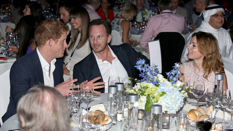 Geri Horner, Christian Horner, and Prince Harry laughing