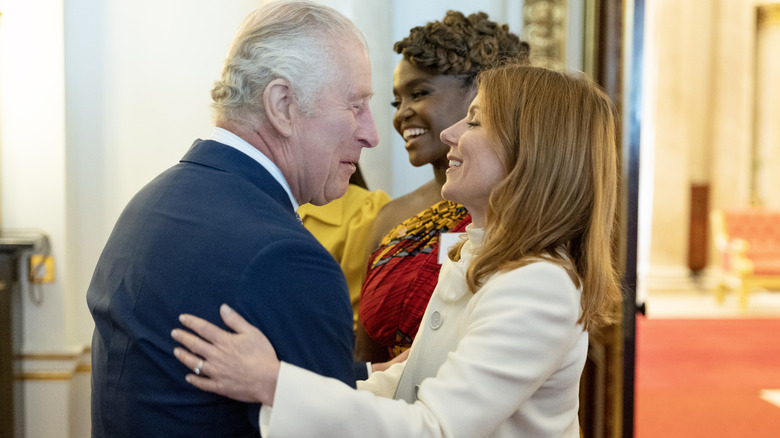 Geri Horner and King Charles III hugging