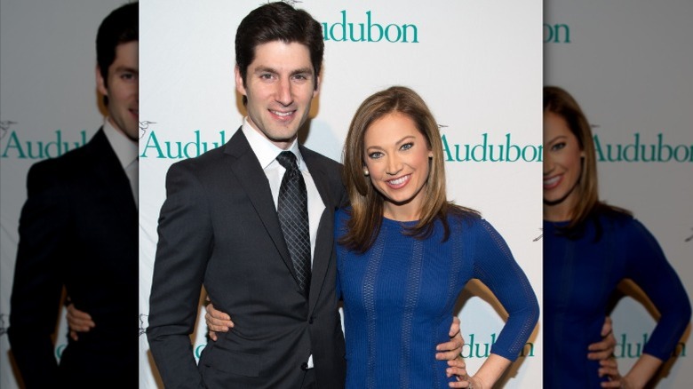 Ben Aaron and Ginger Zee standing with their arms around each other