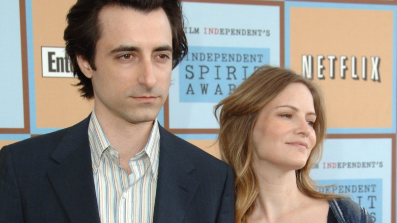 Noah Baumbach and Jennifer Jason Leigh looking different directions