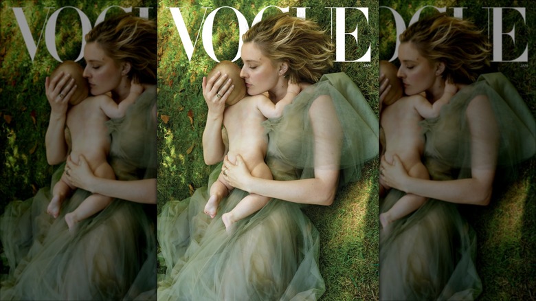 Greta Gerwig on the cover of Vogue holding a baby