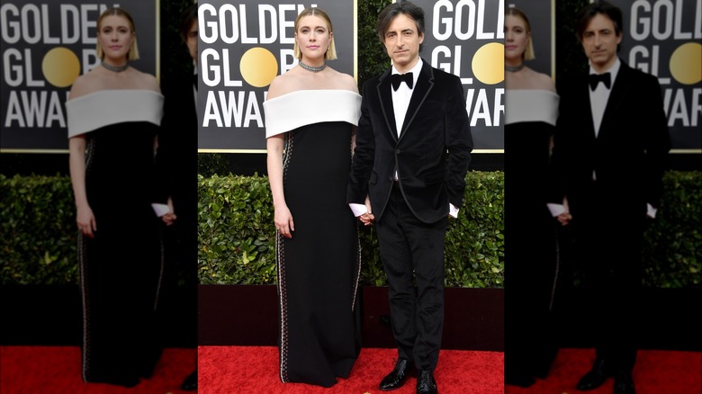 Greta Gerwig and Noah Baumbach holding hands and posing