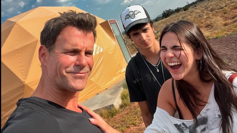 Cameron Mathison smiling and taking a selfie with Leila and Lucas Mathison