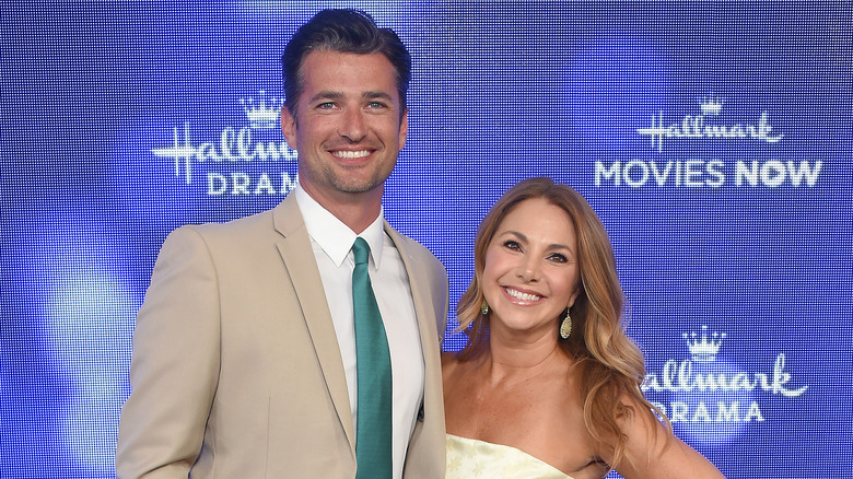 Wes Brown posing with his wife Amanda Brown at a Hallmark event