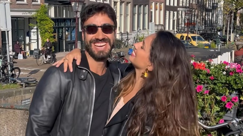 Gabriel Godoy and Raissa Xavier smile and embrace in a still from a video posted to her Instagram