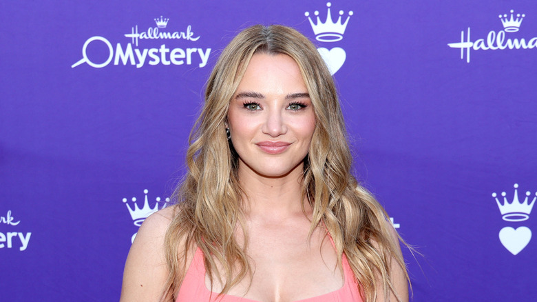 Hunter King smiling in a pink dress