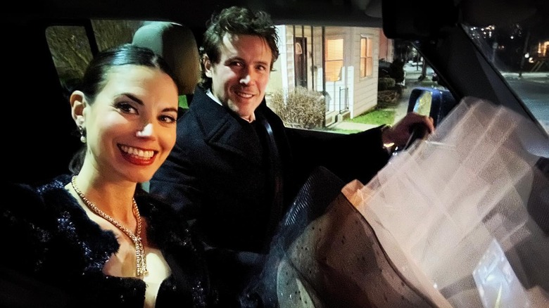 Meghan Ory and John Reardon dressed up in car selfie