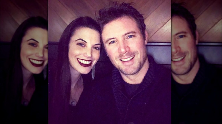 Meghan Ory and John Reardon cozy in a booth