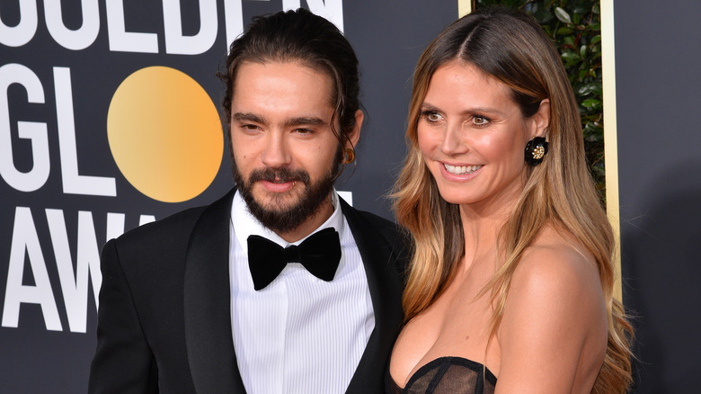 Heidi Klum and Tom Kaulitz posing at Golden Globes